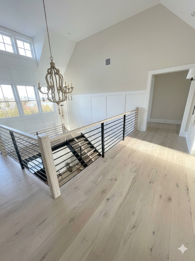 Interior staircase and hardwood landing